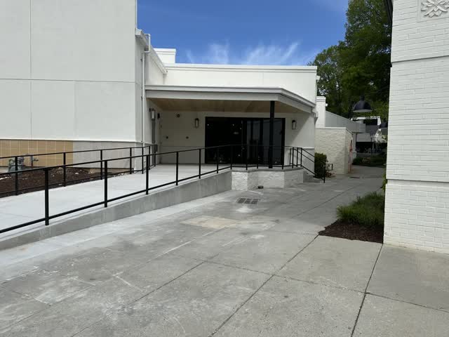 Steel ramp guardrail and handrail at the entrance of a finished building