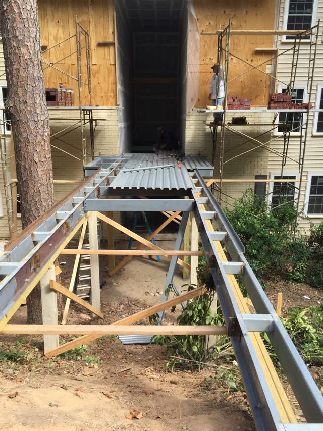Steel stair and landing framing installed at a building under construction