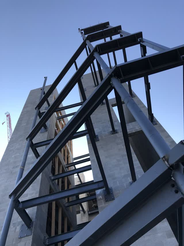 Steel frame rising against open sky on a More Steel jobsite