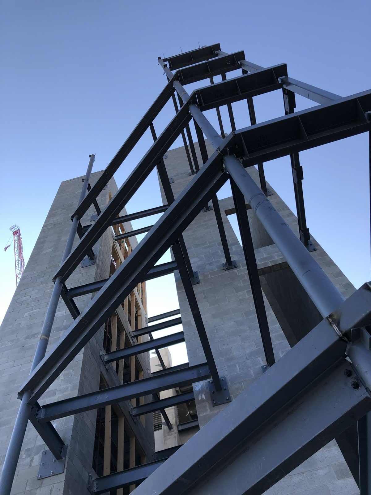 Steel frame rising against open sky on a More Steel jobsite