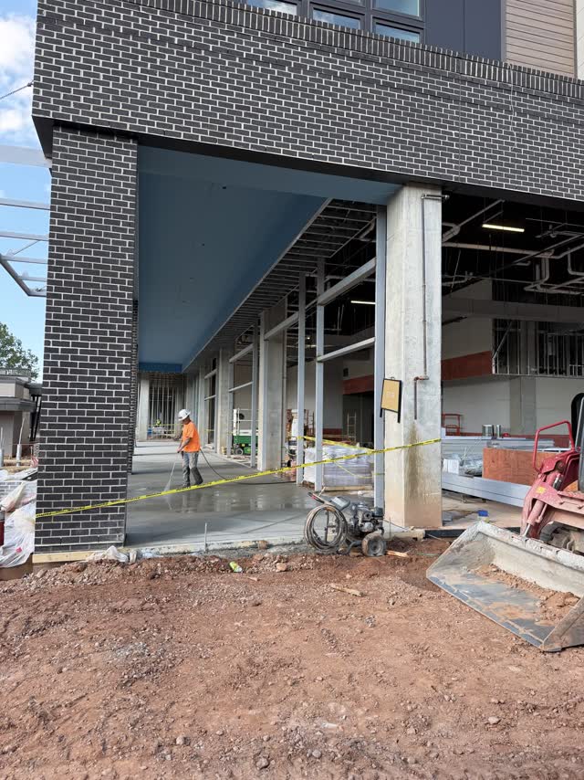 Steel frame and canopy at the ground floor of a mixed-use building