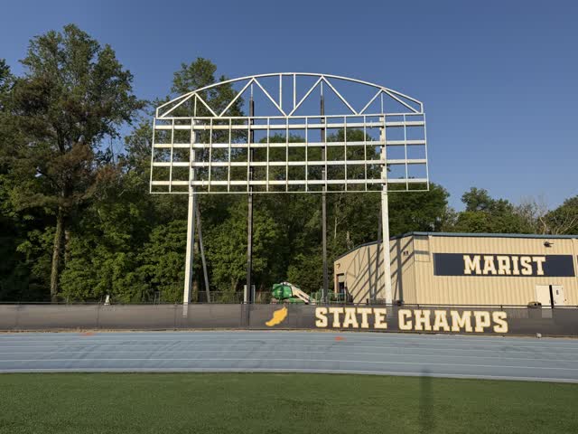 Steel scoreboard support structure fabricated and erected at a school athletic field